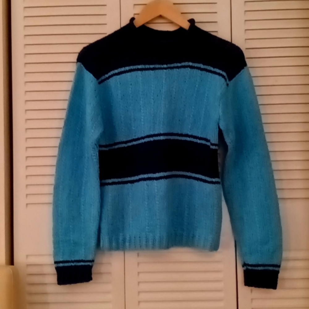 Ladies long sleeve knit sweater with wide stripes that has dark blue and light b